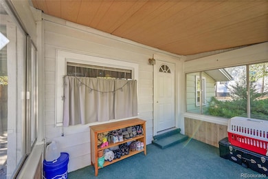 Enclosed front porch, mudroom, sunroom.