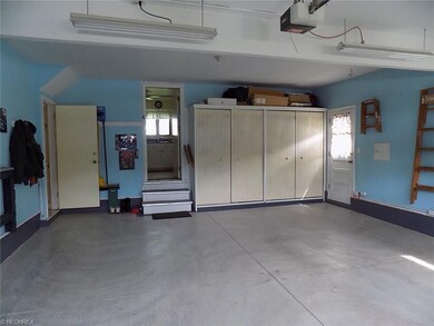Extra storage cabinets and door to the basement. M