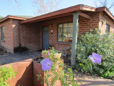 Brick bungalo in front of property
