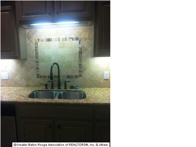 Here's the sink area with the unique backsplash. T