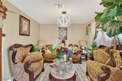 Living room featuring a chandelier and wood finished floors