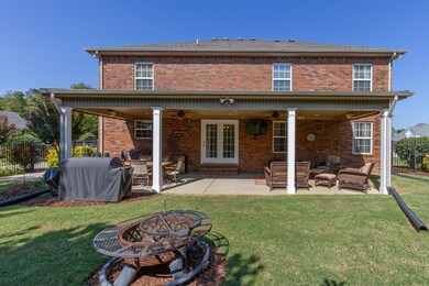 Massive covered back patio measures approx 14 x 40!  And has 2 ceiling fans and TV... perfect for grilling and watching the game