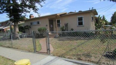 Front view of 105th St. Chain link fence and large