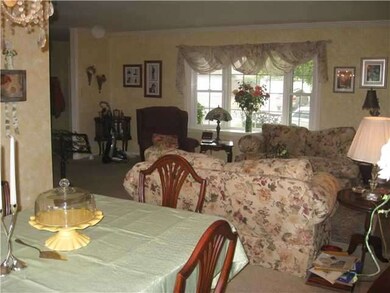 Living room with bay window & fireplace