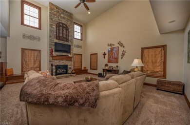 Two-story great room with stone fireplace