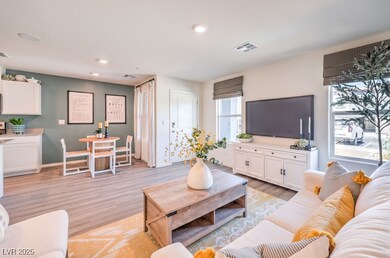 Living room with light wood-style floors, recessed