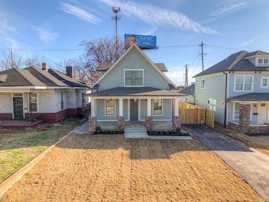 View of front facade with a porch, roof with shing