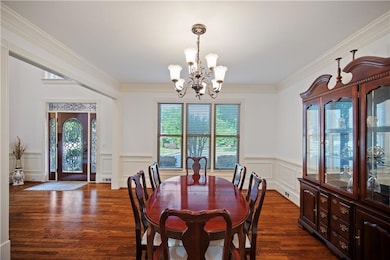 Dining space featuring a chandelier, a decorative 