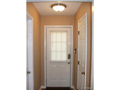 Pedestrian door to driveway, located in the back h