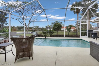 Outdoor pool featuring glass enclosure, a patio, a