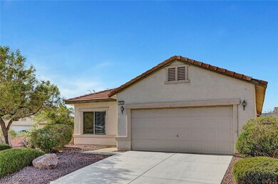 Mediterranean / spanish-style home with a garage,