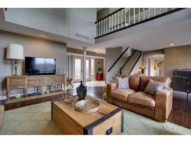 This enormous great room has a gas fireplace, wood