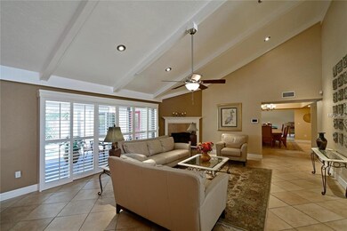 The living room has a gas fireplace and vaulted ce