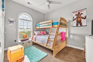 Bedroom featuring carpet flooring and ceiling fan