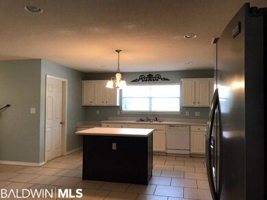Spacious kitchen with island, stainless steel appl