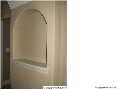 Art niche in hall.