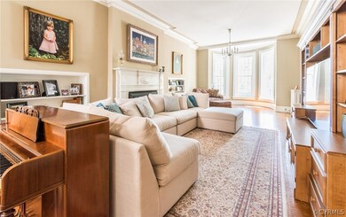 Living room with built-in book cases and fireplace.