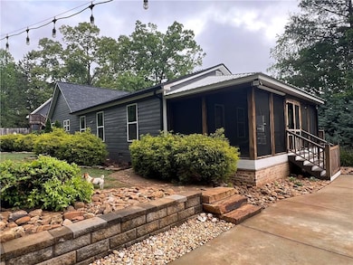 Back View of property with a screened porch