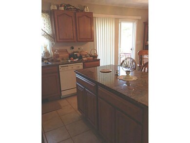 Kitchen. Sliding glass doors to a deck off the kit