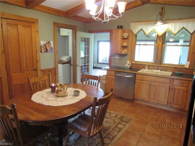 Beautifully updated kitchen looking toward the gre