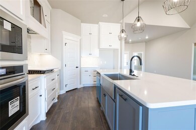Empty room featuring baseboards, dark wood finishe
