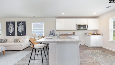 (White cabinets are pictured, but this home will f
