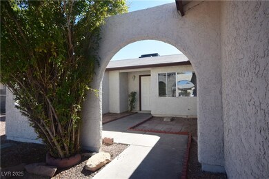 Doorway to property with stucco siding