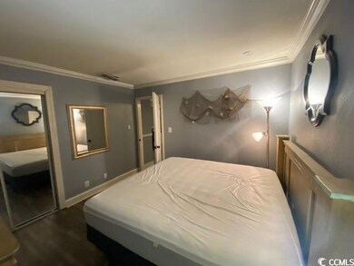 Bedroom featuring wood-type flooring and ornamenta