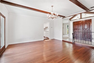 Family room looking to front door, kitchen and liv