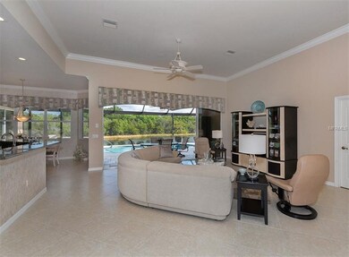 Great room with sliders to lanai and pool