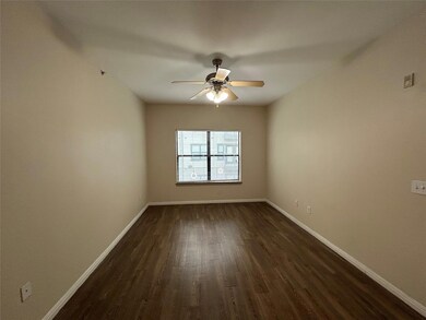 Unfurnished room with dark wood-type flooring, a 