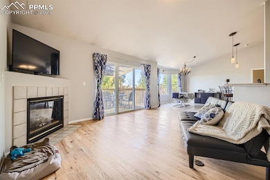 Living room with vaulted ceiling, wood finished fl