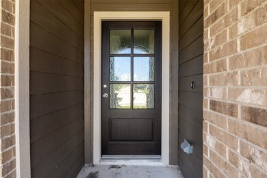 This photo showcases a welcoming front entrance wi