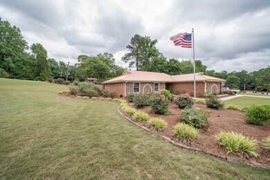 Front of home with gorgeous landscaping