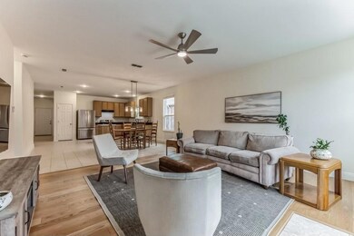 Living room with light hardwood / wood-style floor