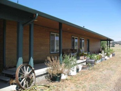 Front porch runs length of house.