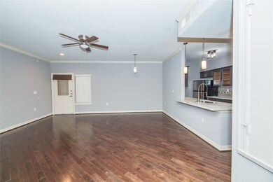 View of entry way and kitchen off the living area.
