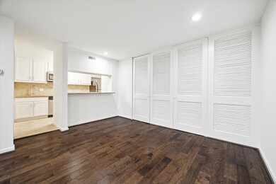 Open Kitcben with Serving Bar.   Note: Louvered Do