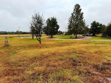 View of green lawn featuring a rural view