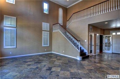 Two Story ceilings & Hardwood stairs