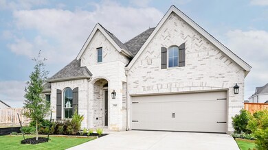French country style house with concrete driveway