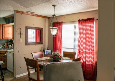 Dining room with a textured walls and entrance int