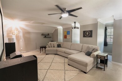 This is a spacious, well-lit living room featuring