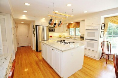GLEAMING WHITE KITCHEN WITH GRANITE COUNTERTOPS, B