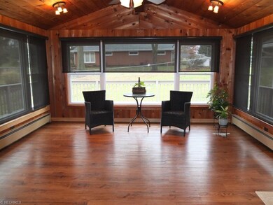 Sun room with vaulted ceilings and skylights has F