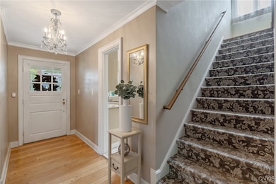 Stepping inside, the foyer has a grand feel with t