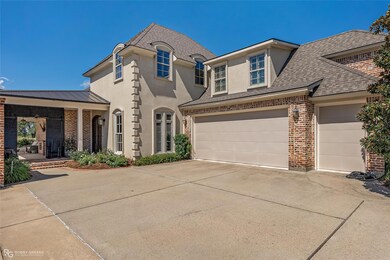 French provincial home featuring a garage
