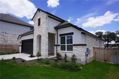 View of front of property with stone siding, stuc