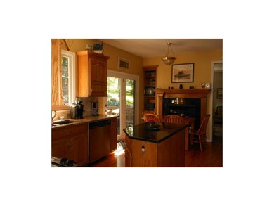 KITCHEN WITH SEE-THROUGH FIREPLACE, ISLAND AND MUC