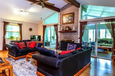 The spacious living room offers vaulted ceilings, 